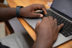 Person typing on laptop